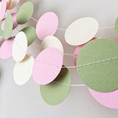 some paper circles are hanging from a string