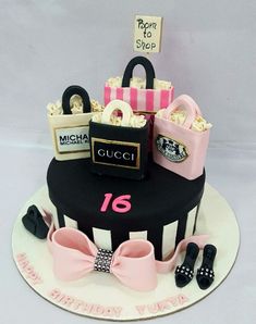 a birthday cake decorated with purses and shoes