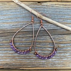 Faceted Amethyst Earrings wrapped with Copper Wire and includes a Nickel Free Ear-Wire: These earrings are light weight, comfortable, simple and fun. Throw them on with any outfit and they will definitely add some pop and sparkle! They are approximately 2.25 inches in length and 1.15 inches at the widest portion. If you would like these in a different color or size, please let me know as I also do customized orders. To view more of my original jewelry designs, visit: https://www.etsy.com/shop/Th Rustic Wedding Jewelry, Wire Wrapped Gemstone Jewelry, February Birthstone Jewelry, Wire Wrapped Stone Jewelry, Original Jewelry Design, Earrings Stone, Natural Stone Earrings, Earrings Wire, Earrings Bohemian