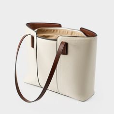 Gender: Women Type: Tote Bag Features: Adjustable Strap, Inner Pockets Main Materials: Cowhide Lining: Polyester Type of Closure: Zipper Style: Casual, Daily, Stylish Size: Length: 40 cm / 15.75 " Width: 28 cm / 11.02 " Height: 12 cm / 4.72 " Cream Square Shoulder Bag For Office, Casual Beige Leather Box Bag, Beige Shoulder Bag With Removable Pouch In Faux Leather, Beige Rectangular Shoulder Bag With Leather Handles, Beige Faux Leather Shoulder Bag With Removable Pouch, Beige Large Capacity Hobo Bag For Office, Beige Rectangular Faux Leather Bucket Bag, Versatile Beige Faux Leather Bag, Beige Large Capacity Office Bag