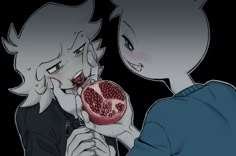 two people are eating pomegranates in the dark