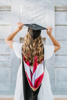 a woman wearing a graduation cap and gown