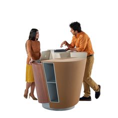 a man and woman standing next to each other in front of a computer desk that is shaped like a trash can