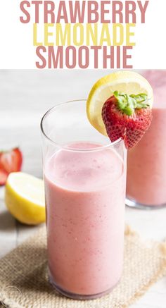 a strawberry lemonade smoothie is garnished with fresh strawberries