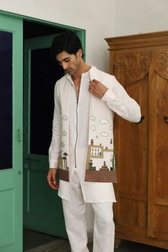 *PRODUCT DETAILS:- Indulge in comfort and style with our Front Open Long Jacket With Zipper Plain Short Kurta and Trouser set, crafted from breathable Pure Linen Fabric. The intricate Resham Embroidery Work on the jacket and wooden button closure on sleeves cuffs add a touch of refinement to this contemporary ensemble. *FEATURES:- Color:  white Fabric: 100% pure linen Design Type: Embroidery for jacket only Items Included:  (i)  Kurta (100% linen)                               (ii) Pant (100% linen)                               (iii) Jacket (Georgette fabric) Wash Care: Dry Clean Only Disclaimer Text: Product color may slightly vary due to photographic lighting sources or your monitor/screen settings. Lenin Kurta For Men, Embroidered Linen Long Sleeve Sets, Festive White Linen Sets, White Cotton Nehru Jacket, Casual Cotton Nehru Jacket With Long Sleeves, Traditional White Nehru Jacket For Summer, White Cotton Nehru Jacket With Long Sleeves, Casual Cotton Long Sleeve Nehru Jacket, Casual Cotton Long-sleeve Nehru Jacket