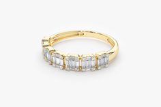 "Baguette Diamond Ring / 14k Gold Half Eternity Baguette and Round Diamond Stackable Ring / Diamond Anniversary Band by Ferkos Fine Jewelry Features ✔Made to Order ✔Gold Kt: 14K (also available in 18K) ✔Available Gold Color: Rose Gold, Yellow Gold, White Gold ✔Round Diamond: 28 pcs 1.1 MM ✔Baguette Diamond: 14 pcs 2.25x1.25 MM ✔Baguette Diamond: 7 pcs 2.25x1.50 MM ✔Baguette Diamond: 14 pcs 1.75x1.05 MM ✔Number of Stones: 63 ✔Total CTW: 0.65 ✔ Diamond Color-Clarity: G Color VS Clarity If you have Formal Yellow Gold Baguette Diamond Ring, Formal Baguette Cut Diamond Ring, Formal Baguette Diamond Ring, Classic Evening Ring With Baguette Cut, Evening Rings With Baguette Diamonds, Baguette Half Eternity Jewelry For Anniversary, Formal Baguette Diamond Ring Fine Jewelry, Anniversary Baguette Half Eternity Jewelry, Evening Baguette Diamond Rings