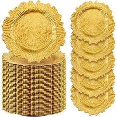 a stack of gold plates sitting on top of each other