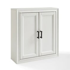 a white cabinet with two doors and black handles