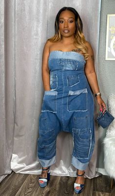 Upgrade your style game with our Patchwork Denim Bandeau Jumpsuit! Featuring a trendy patchwork design, a comfortable loose fit, and convenient pockets, this jumpsuit is perfect for any occasion. With a chic bandeau top and an easy-to-use back zipper closure, you'll make a statement at any event this season. Fits true to size for most Lightweight denim fabric Model wearing a size Medium small fits 2-6 medium fits 8-10 large fits 12-14 item does not have stretch but has a baggy fit. Denim Attire, Womens Denim Jumpsuit, Afrocentric Decor, Denim Party, Bandeau Jumpsuit, Denim Outfits, Denim Ideas, Patchwork Denim, Swag Outfits For Girls