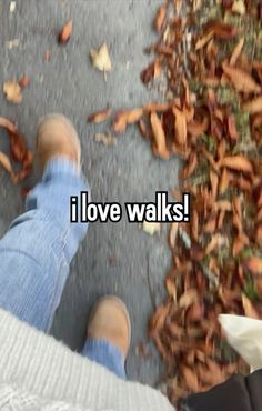 two people standing next to each other with leaves on the ground and words that read i love walks