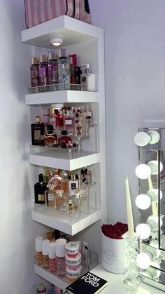 a white shelf filled with lots of cosmetics and other personal care items next to a mirror