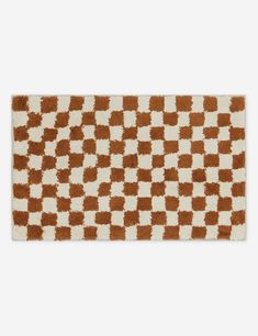 a brown and white rug with squares on it