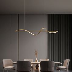 a modern dining room table and chairs with an elegant light fixture hanging over the table