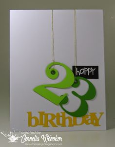 a birthday card with the number three hanging from it