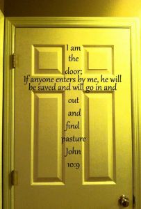 a door with the words i am the door if anyone enters by me, he will be saved and will go in and out