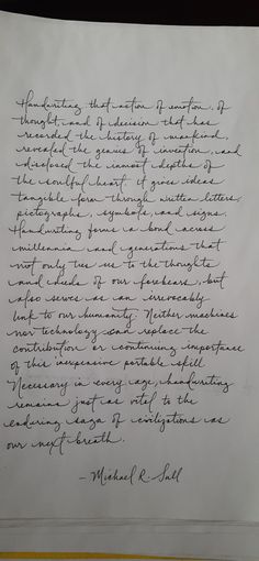 a handwritten letter with black ink on white paper