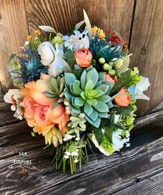 a bridal bouquet with succulents and flowers sits on a wooden bench