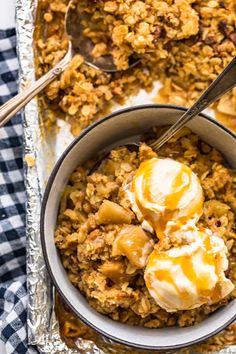 a bowl filled with granola and ice cream on top of a checkered table cloth