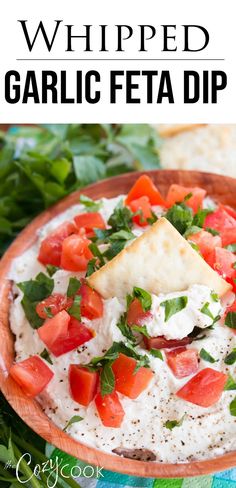 a bowl filled with garlic feta dip