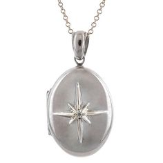 Centering an eight point star set with a Round Brilliant cut diamond weighing approx. 0.02ct, on a Sterling Silver of 18k yellow gold & Sterling Silver locket measuring approx. 1 1/8 x 5/8 inch. Suspended from a Sterling Silver chain 16 inches. Oval Locket Necklace Silver, Star Locket Necklace, Silver Locket Aesthetic, Formal Star-shaped Jewelry With Diamond Accents, Formal Star-shaped White Gold Jewelry, Formal White Gold Star Of David Jewelry, Formal White Gold Star-shaped Jewelry, Formal White Gold Star Jewelry, White Gold Star Charm Round Pendant