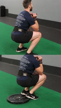 a man squatting down while using a cell phone