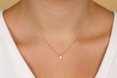 Dimensions of Star: 6 mm (less than a quarter of an inch) This dainty gold star can be worn on its own for a minimalist look or stacked up with other necklaces. The star is not flat, but thicker gold for a more solid look. Pair it with Sarah Elise mini moon necklace for a truly celestial look! Available 14K Solid White, Solid Yellow, Solid Rose Gold Worldwide DHL shipping now available 1-3 business days NOW USING ITALIAN TRIGGER LOBSTER CLASPS 🛠 All Sarah Elise pieces are handcrafted to order, Dainty Star-shaped Yellow Gold Jewelry, Dainty Yellow Gold Star Jewelry, Delicate Yellow Gold Star Jewelry, Delicate Star-shaped Yellow Gold Necklace, Delicate Yellow Gold Star Necklace, Tiny Star-shaped 14k Gold Jewelry, Gold Star Necklace, Star Necklace Gold, Star Charm Necklace