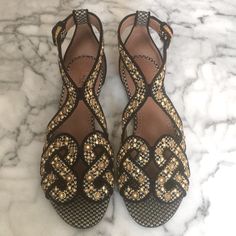 New Alaia Black And Ivory Woven Raffia Sandals With Gold Metal Embellishments Size 38 Made In Italy Insole Measures About 10 Inches Long 1/8 Inch Heel Buckled Ankle Strap Closure New Without Box Or Dust Bag Alaia Shoes, Raffia Sandals, Metal Embellishments, Embellished Flats, Woven Raffia, Flat Sandals, Women's Shoes Sandals, Ankle Strap, Gold Metal