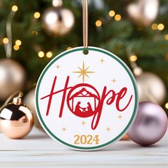 a christmas ornament with the word hope on it