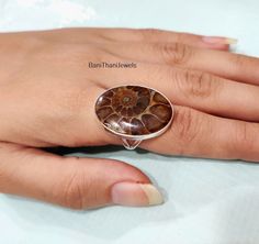 Welcome To Our Shop:- Bani Thani Jewels Description:- Style:- Ring Advantages of Ammonite Fossil Ring:- The ammonites became extinct at the end of the Cretaceous, at roughly the same time as the dinosaurs disappeared. However, we know a lot about them because they are commonly found as fossils formed when the remains or traces of the animal became buried by sediments that later solidified into rock. Occasion:- Anniversary Gift, Birthday Gift, Wedding Gift, Gift Pendant, Valentine's Gift, Engagement Gift, New Year Gift, Christmas Gift, Other Occasion & Parties, etc. Your order will be handmade and ready for shipment in 1-3 business days. Normally we ship through USPS which takes a maximum of 2 to 3 weeks if you need fast delivery you can select shipping in your cart. Why choose us over othe Bani Thani, Fossil Ring, Fossil Jewelry, Ammonite Fossil, Jewelry Statement, Valentine's Gift, Women Ring, Ring Women, Nouvel An