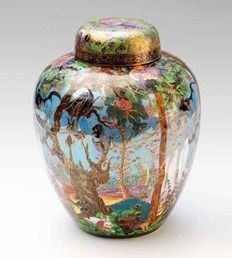 a colorful vase with trees painted on it