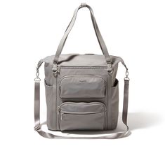 a gray bag with two pockets and straps on the front, sitting against a white background