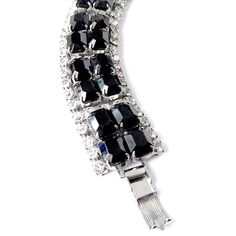 "Item: This is a classic 1950s rhinestone bracelet with rectangular jet black glass emerald cut stones and clear rhinestones on a silver tone setting. It's perfect for that \"little black dress\" or any outfit when you want a little black and silver bling. It's in excellent condition and ready to wear. Be sure to Favorite this piece and check our other listings for lots more antique and vintage jewelry! Signature: Unsigned Measurements: 1\" w x 7\" long Condition: 9.5 - Excellent condition Shipp Rectangular Crystal Jewelry For Evening, Evening Metal Crystal Bracelet, Formal Jeweled Crystal Bracelet, Evening Crystal Bracelets Costume Jewelry, Glamorous Formal Jewelry With Black Diamonds, Formal Crystal Costume Jewelry Bracelet, Glamorous Black Diamond Jewelry For Formal Events, Glamorous Black Diamond Jewelry For Formal Occasions, Glamorous Formal Black Diamond Jewelry