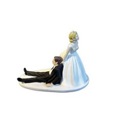 a figurine of a bride and groom on a surfboard