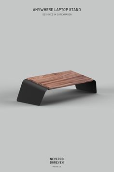 an image of a wooden table with black legs and the words anywhere laptop stand on it