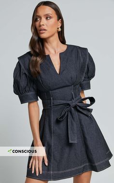 Stand out from the crowd in our Dolores Mini Dress! This casual black dress features a close V-neckline and short puff sleeves for an effortlessly chic look. Made from cotton, this shift dress is not only comfortable but also breathable, making it perfect for those warm summer days. The belted waist adds definition to your figure, giving you a flattering silhouette. Whether you're heading out for brunch with friends or attending a casual event, this mini dress is sure to turn heads and make you Casual Black Dress, Short Puff Sleeve, Black Dresses Casual, Casual Black, Belted Dress, Puff Sleeves, Summer Days, Dress Making, Shift Dress