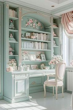 a room with a desk, bookshelf and flowers on the shelves in it