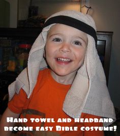 a young boy wearing a towel and headband with the words hand towel and headband become easy bride costume