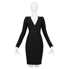 Resurrection is excited to offer a stunning vintage John Galliano black widow cocktail dress featuring a deep V neckline, long sleeves with covered buttons, shoulder pads, curved seams, and a fitted body. From the 1997 collection. John Galliano Size 38 60% Wool, 36% Polyester, 4% Elastane, Lining 97% Silk, 3% Elastane 1997 Runway Collection Excellent Vintage Condition Authenticity Guaranteed Black Widow Cocktail, Black Tuxedo Dress, Workwear Dresses, Dior Haute Couture, Vintage Workwear, Tuxedo Dress, Black Tuxedo, Dress With Long Sleeves, Carrie Bradshaw