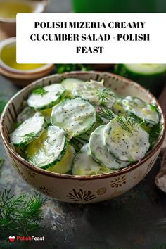 a bowl filled with cucumber salad and topped with dill pickle slices