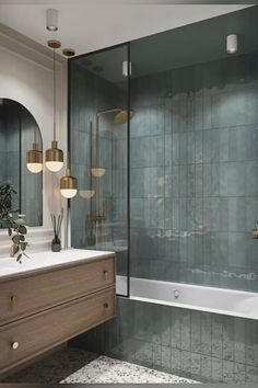 a bathroom with a sink, mirror and bathtub next to a shower stall filled with plants