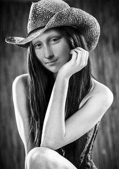 black and white photograph of a woman wearing a hat