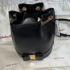 Salvatore Ferragamo Vara Bucket Bag In Small Nwt. Duster Bag Included. 100% Authentic. Plastic Film Still On Hardware. Size Base Length: 6.50 In Width: 5.50 In Height: 7.75 In Luxury Bucket Bag With Gold-tone Hardware Satchel, Luxury Satchel Bucket Bag For Office, Luxury Bucket Bag Satchel For Office, Designer Bucket Bag With Gold-tone Hardware, Designer Bucket Bag Satchel With Gold-tone Hardware, Luxury Bucket Bag With Gold-tone Hardware For Shopping, Elegant Clutch Bucket Bag With Detachable Handle, Elegant Bucket Bag Clutch With Detachable Handle, Luxury Bucket Bag With Detachable Strap For Shopping