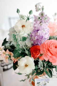 Image of a pastel wedding centerpiece featuring pink peonies, blue hydranegas and a mix of other pastel flowers, in a rose gold compote. Pastel Wedding Centerpieces, Pastel Flowers