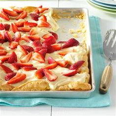 a dessert with strawberries on top is ready to be eaten