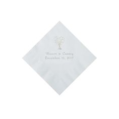 a white napkin with a tree on it