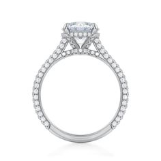 a white gold engagement ring with an oval center stone surrounded by round brilliant cut diamonds