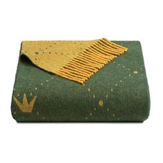 a green and yellow blanket sitting on top of a table