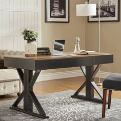 a desk with a laptop computer on top of it