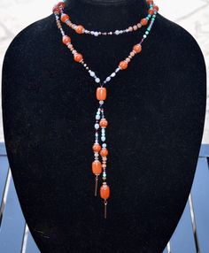 Beautiful multi gemstone beaded long layering statement necklace with Red Jasper and African Turquoise gemstone beads.  This beautiful rustic earthy bohemian necklace is 27 inches long and goes over the head.  The dangles in the front are 7 inches long.  It's very comfortable to wear and goes with many different outfits.  Along with the gemstones it also has beautiful crystal fire polish beads, 11/0 black miyuki seed beads, copper and silver spacer beads, caramel colored rondelle beads, crystal Bohemian Hand-strung Necklaces For Layering, Bohemian Gemstone Beaded Necklaces For Layering, Bohemian Gemstone Beads Necklace For Layering, Red Bohemian Lariat Necklace, Bohemian Long Necklace With Natural Stones For Layering, Bohemian Long Necklace With Round Beads For Layering, Handmade Bohemian Red Long Necklace, Handmade Red Bohemian Long Necklace, Bohemian Handmade Long Necklace For Layering