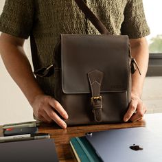 "Personalized Leather Mini Crossbody Messenger Bag, Leather Satchel Bag, Unisex Shoulder Bag, Genuine Leather Saddle Bag, Handmade Bag Gift Material: Full-Grain Genuine Leather Colors: Black/Brown Dimensions: 11.25\" x 9.25\" x 2\" Each bag is meticulously handmade using genuine leather, ensuring both durability and a timeless aesthetic. The rich Dark Brown and sleek Black color options add a touch of sophistication to any outfit, making them perfect for both casual and formal occasions. With a Leather Shoulder Flap Bag For School, Leather School Shoulder Flap Bag, Leather Satchel With Mobile Phone Bag For School, Leather Flap Shoulder Bag For School, Leather Shoulder Bag With Top Carry Handle For School, Brown Leather Backpack With Phone Pocket For Everyday, Business Crossbody Backpack With Mobile Phone Bag, Leather School Bag With Top Carry Handle, Leather Shoulder School Bag